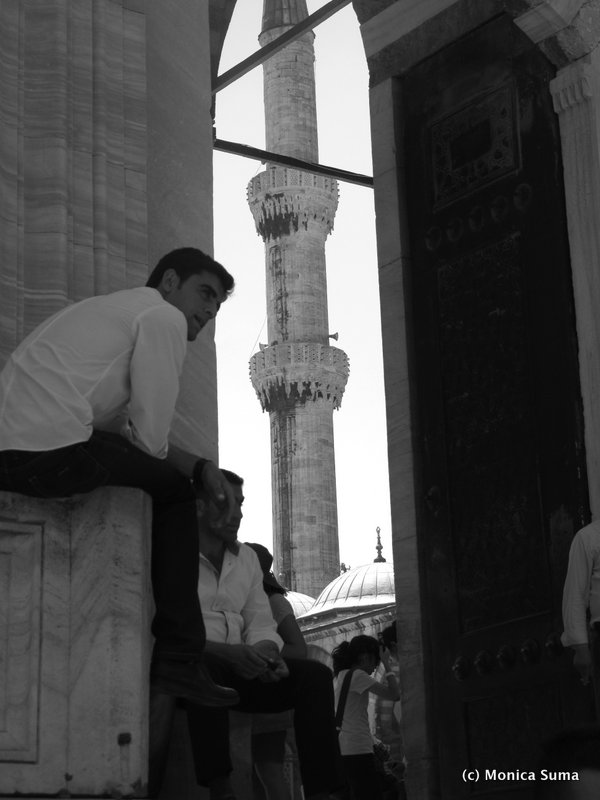 Man sitting outside Sultanahmet Blue Mosque 